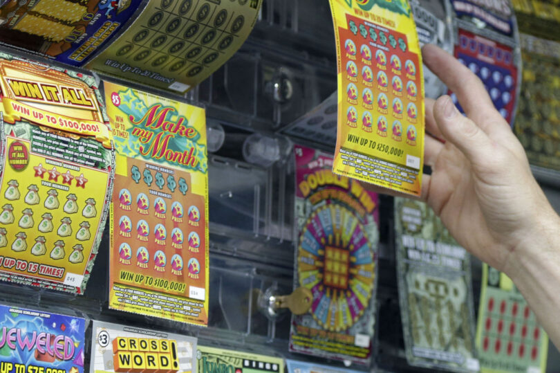 a wall of scratch off lottery tickets