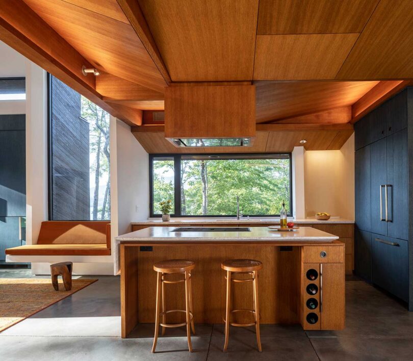 interior view of modern kitchen with wood ceiling and cabinets