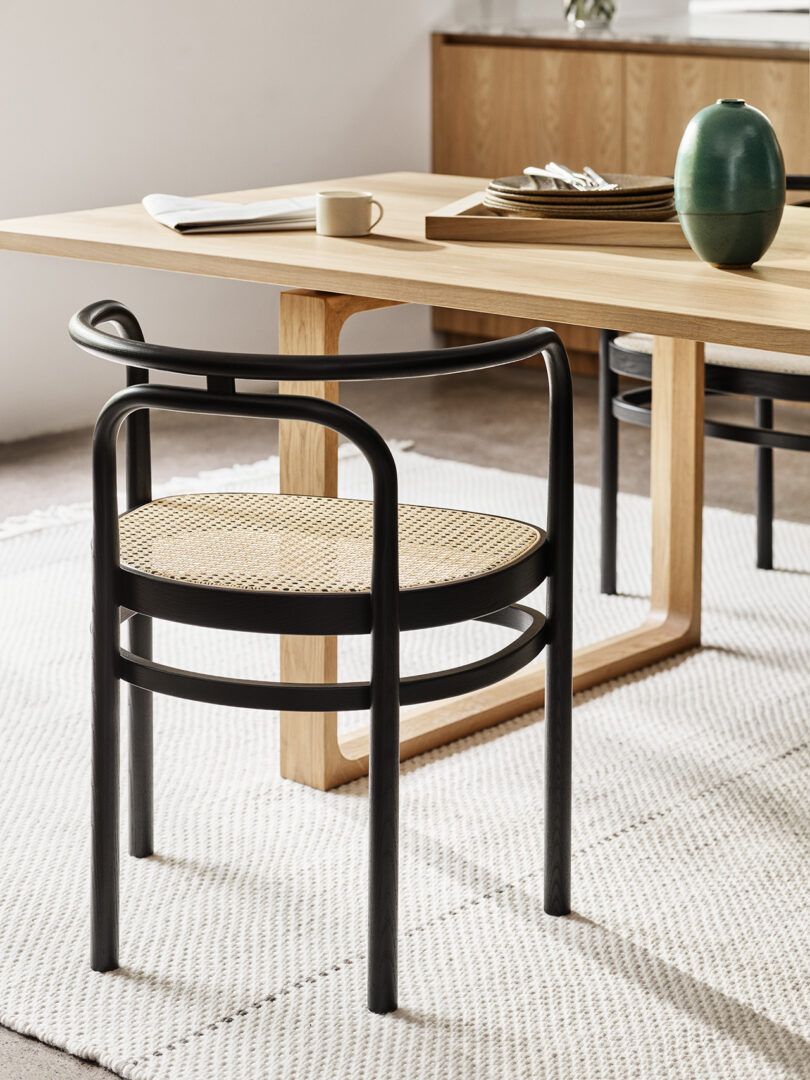 black bentwood chair in styled dining space