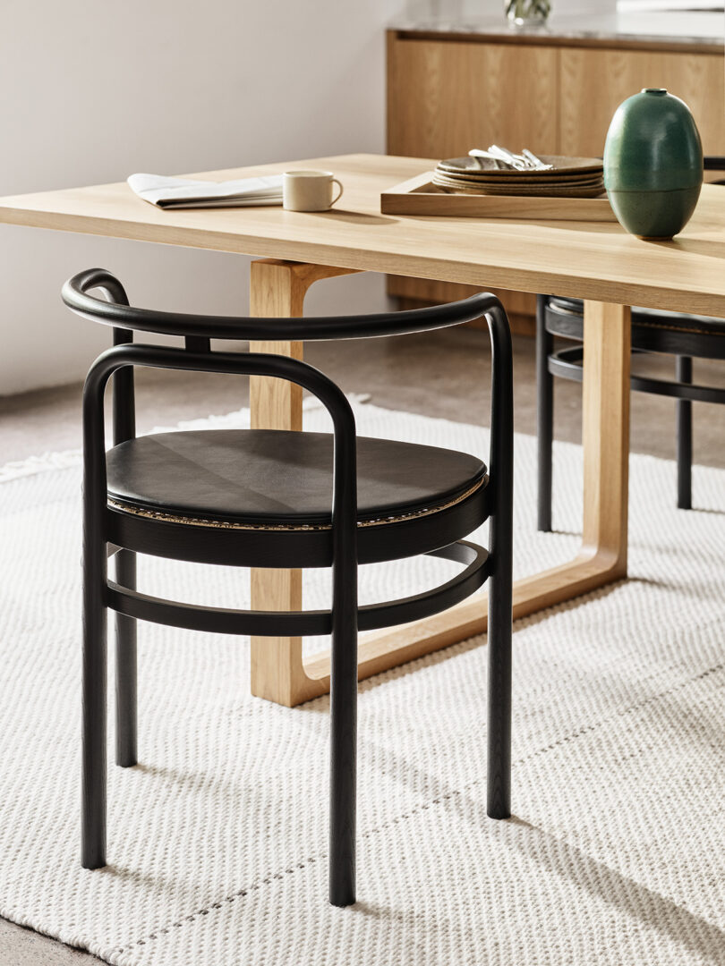 black bentwood chair in styled dining space