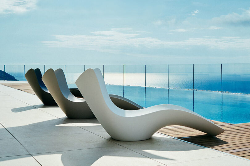 three curvaceous organic chaise lounges outside