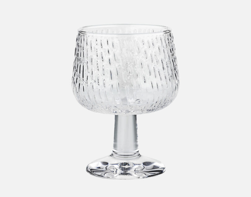 clear glass goblet on white background