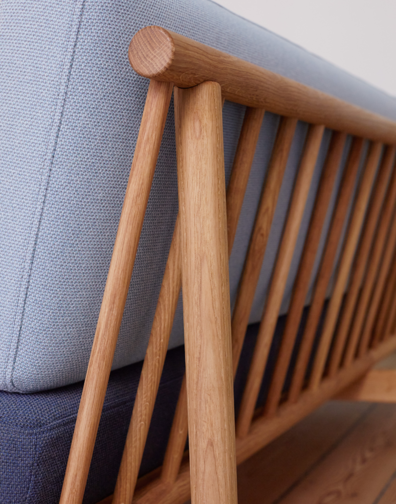 A detail of the wooden spokes that comprise the sofa's backrest