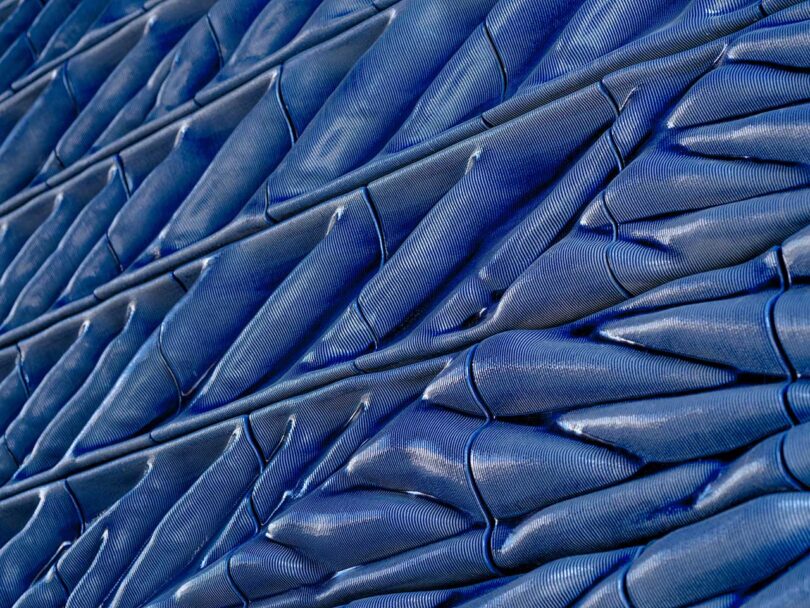 closeup angled view of cobalt blue 3d-printed ceramic tiles