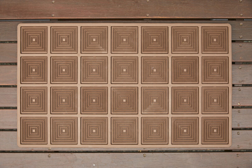 overhead view of a geometric brown doormat