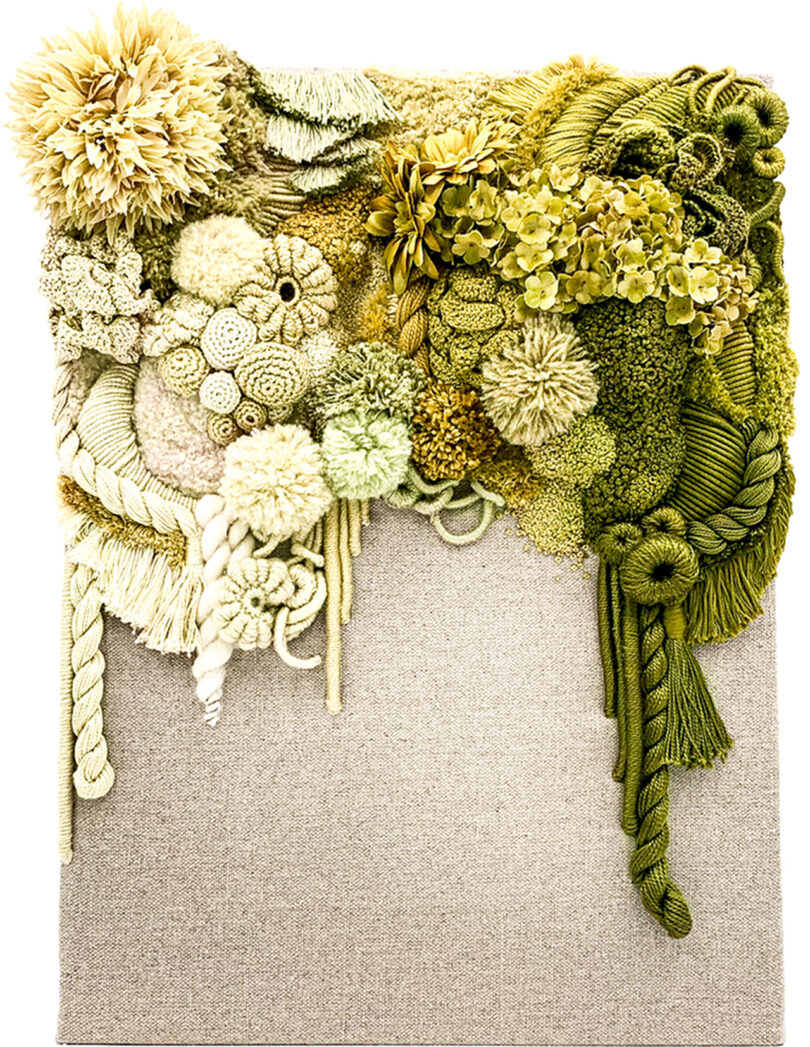 textile wall sculpture in shades of white, yellow, and green