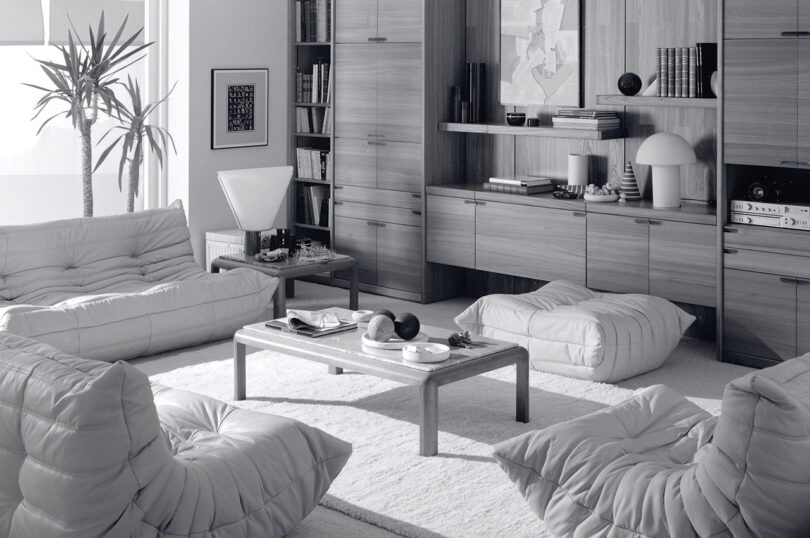 black and white photo of a living space with low, modular seating