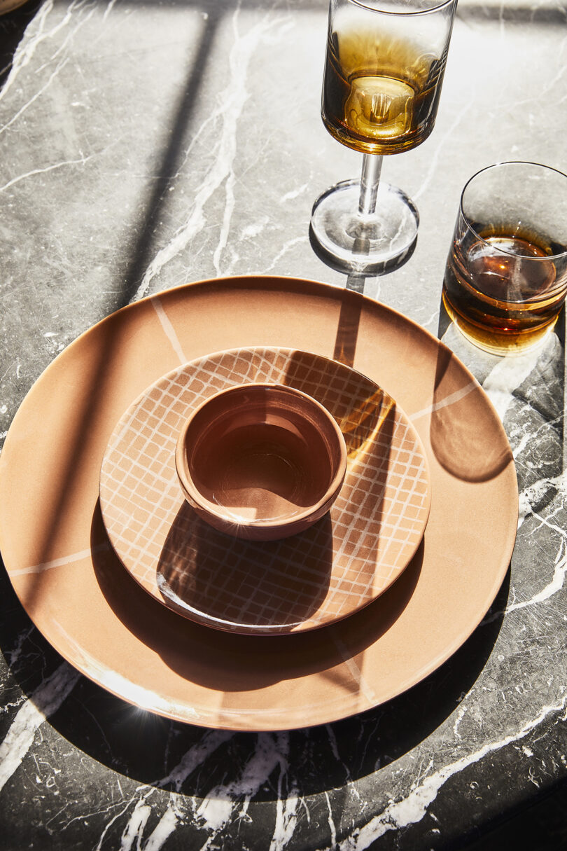 terracotta tableware on a staged table