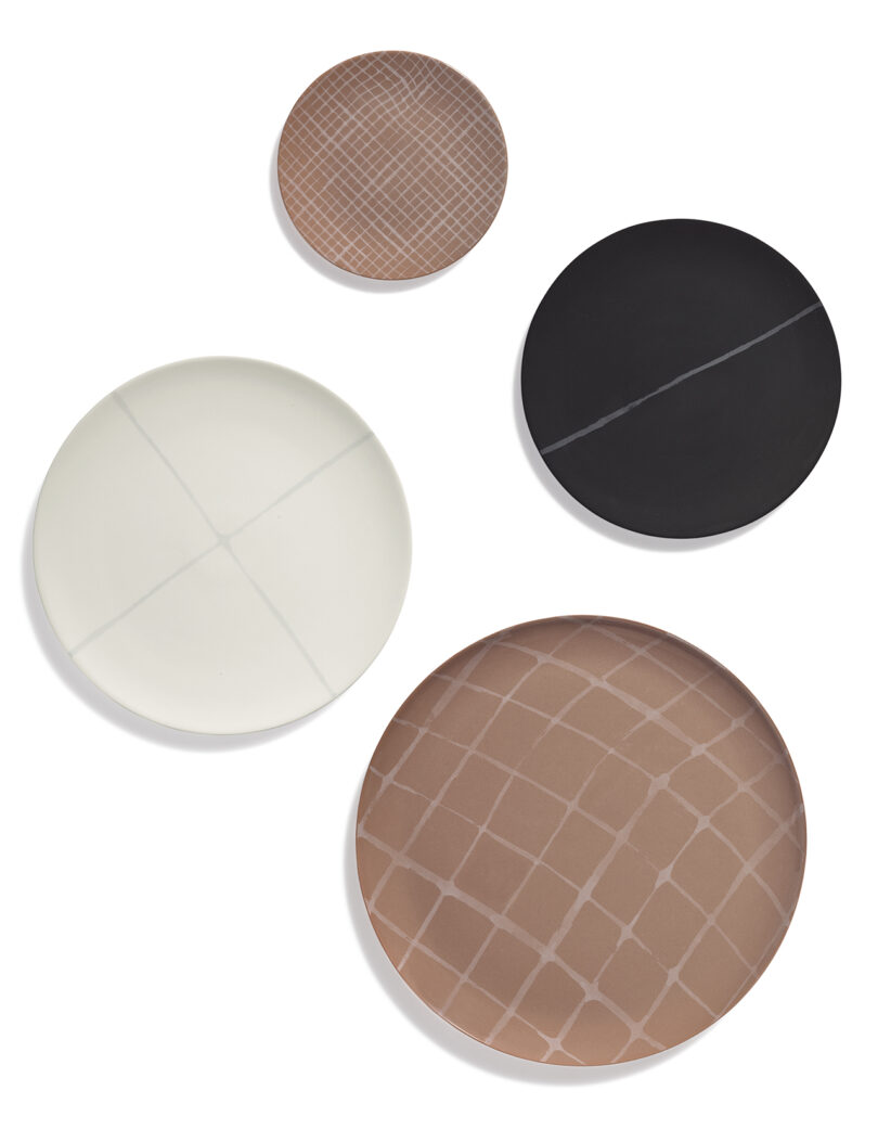 white, black, and terracotta tableware on a white background