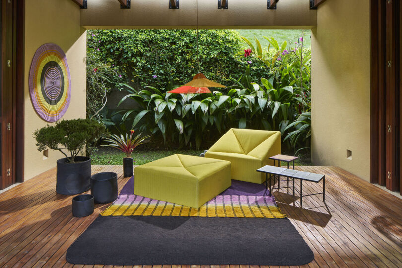 boxy yellow chair and matching ottoman on a patio