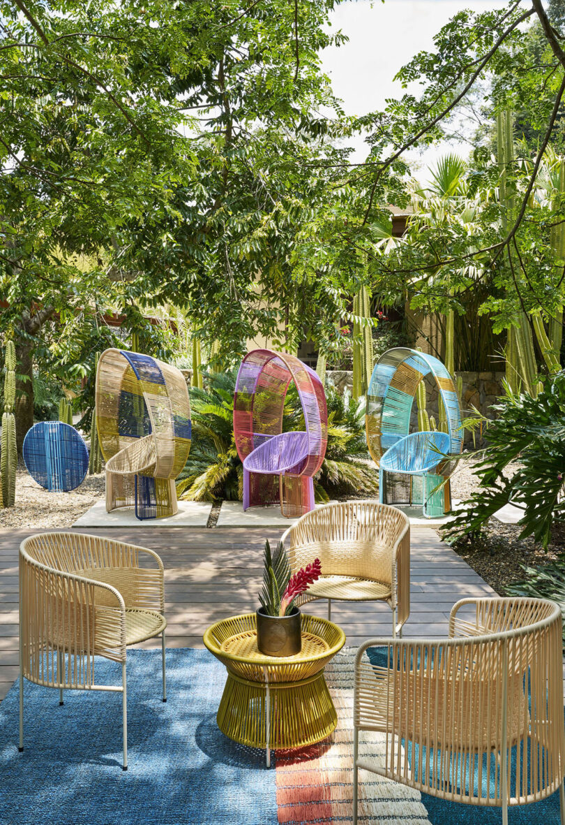 three multicolor woven chairs with hoods outdoors