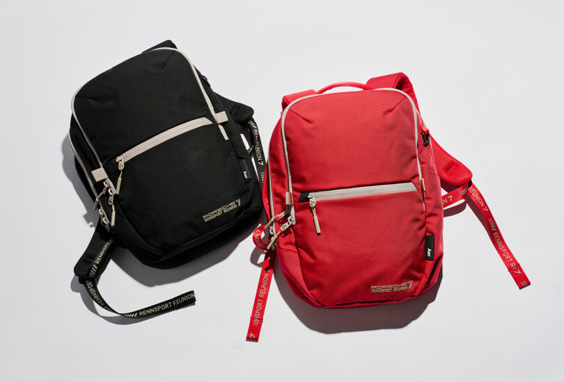 Two Aer x Porsche Rennsport Reunion 7 backpacks in black and red.