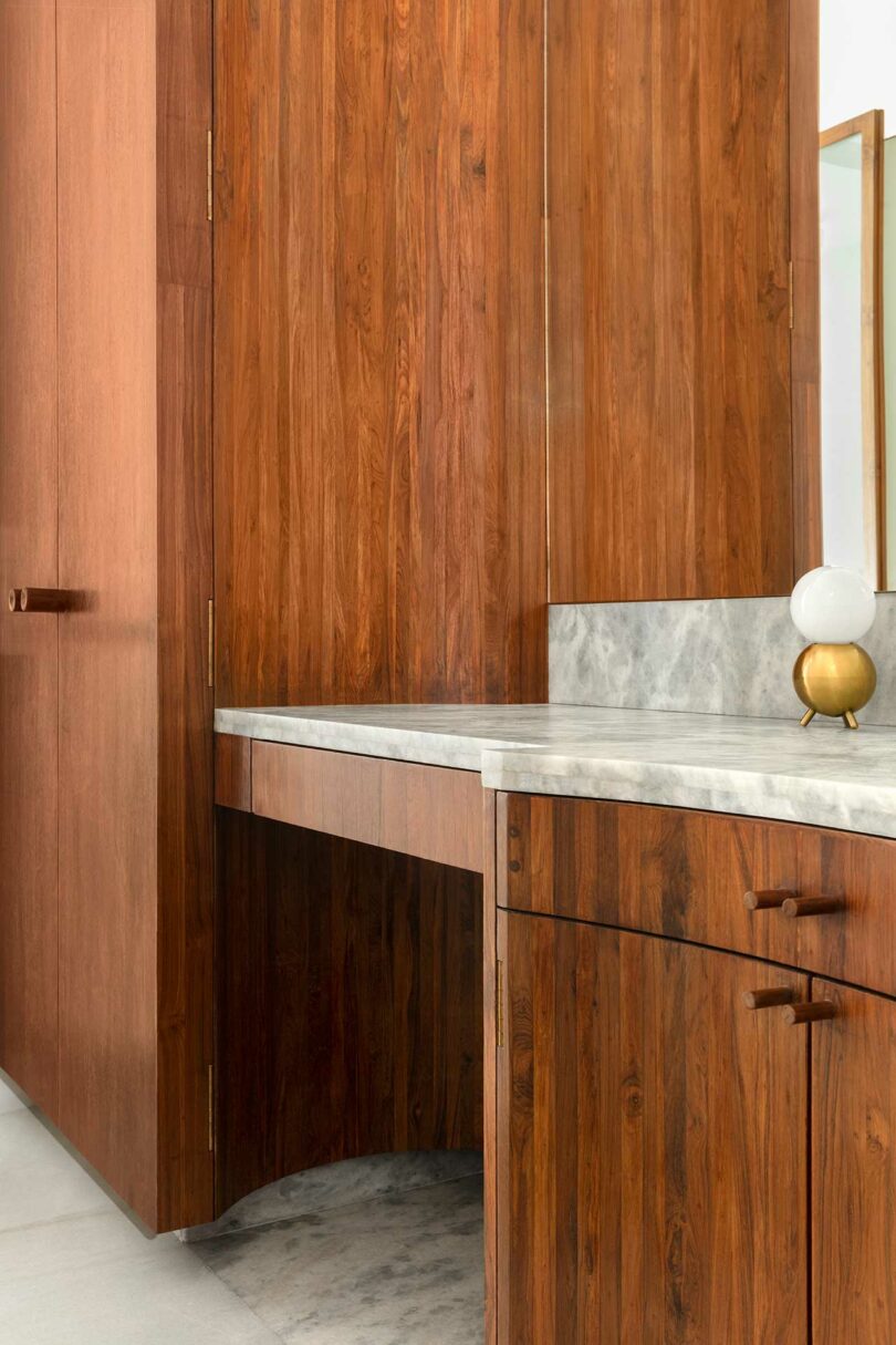closeup of modern bathroom with wood cabinets