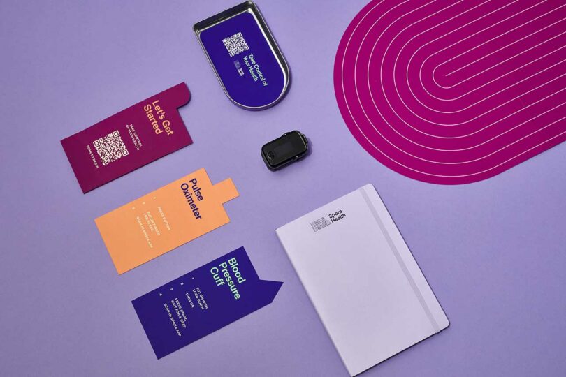 angled flat lay of pamphlets and medical gear on lavender background