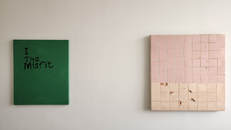 two pieces of square art, one green and one light pink