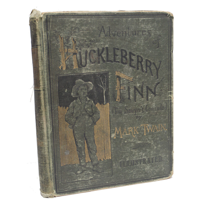 old book cover reading The Adventures of Huckleberry Finn