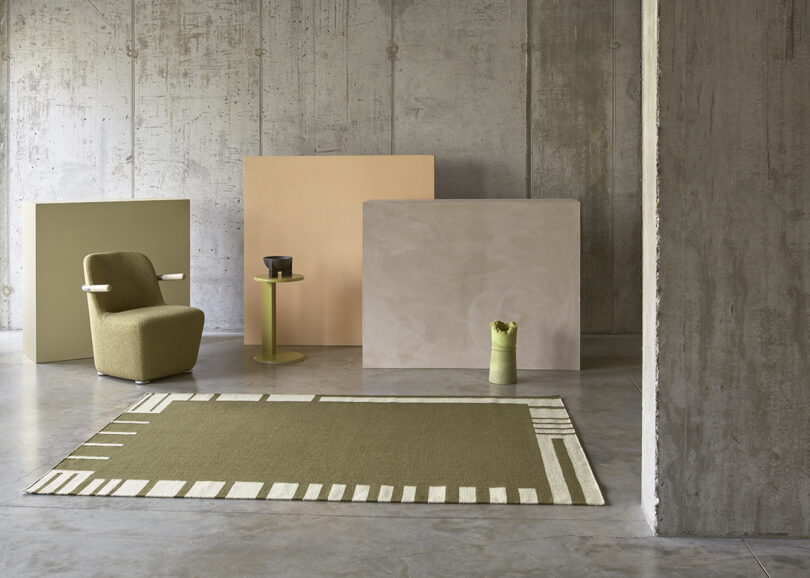 rectangular olive green rug in studio space