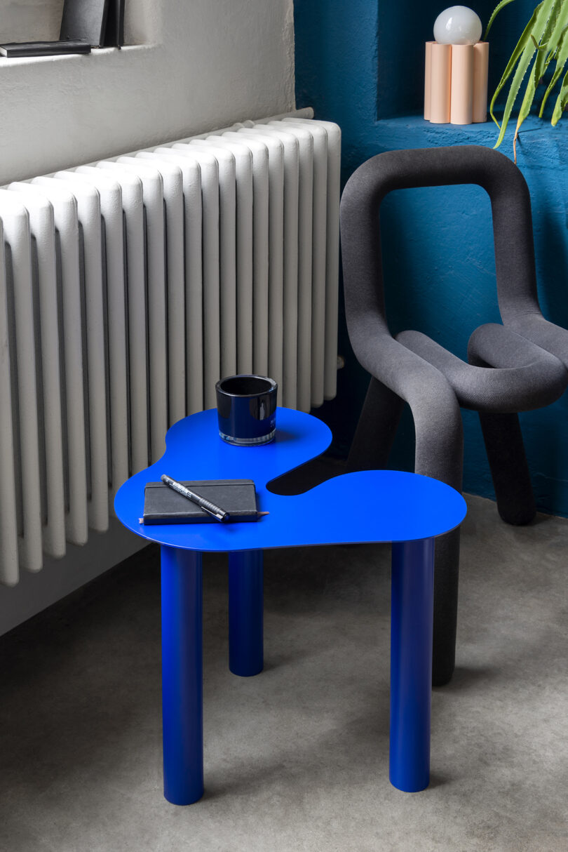 blue occasional table in a styled living space
