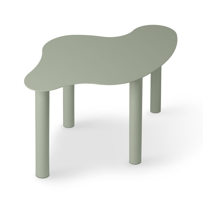 green abstract shaped occasional table on a white background