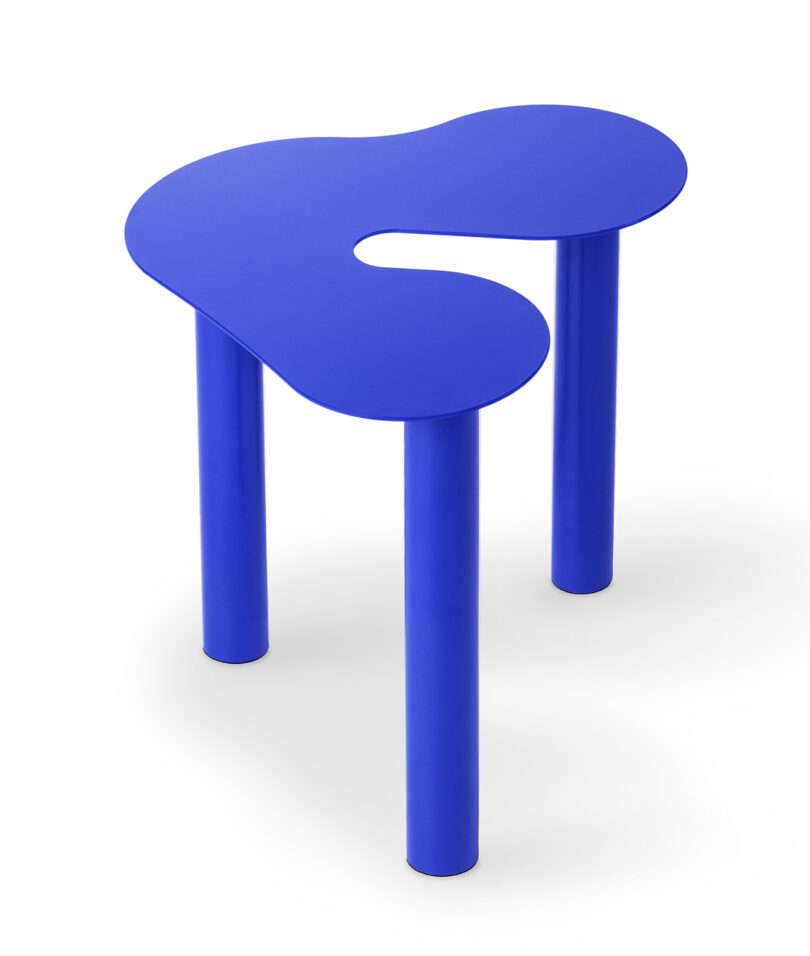 blue abstract shaped occasional table on a white background