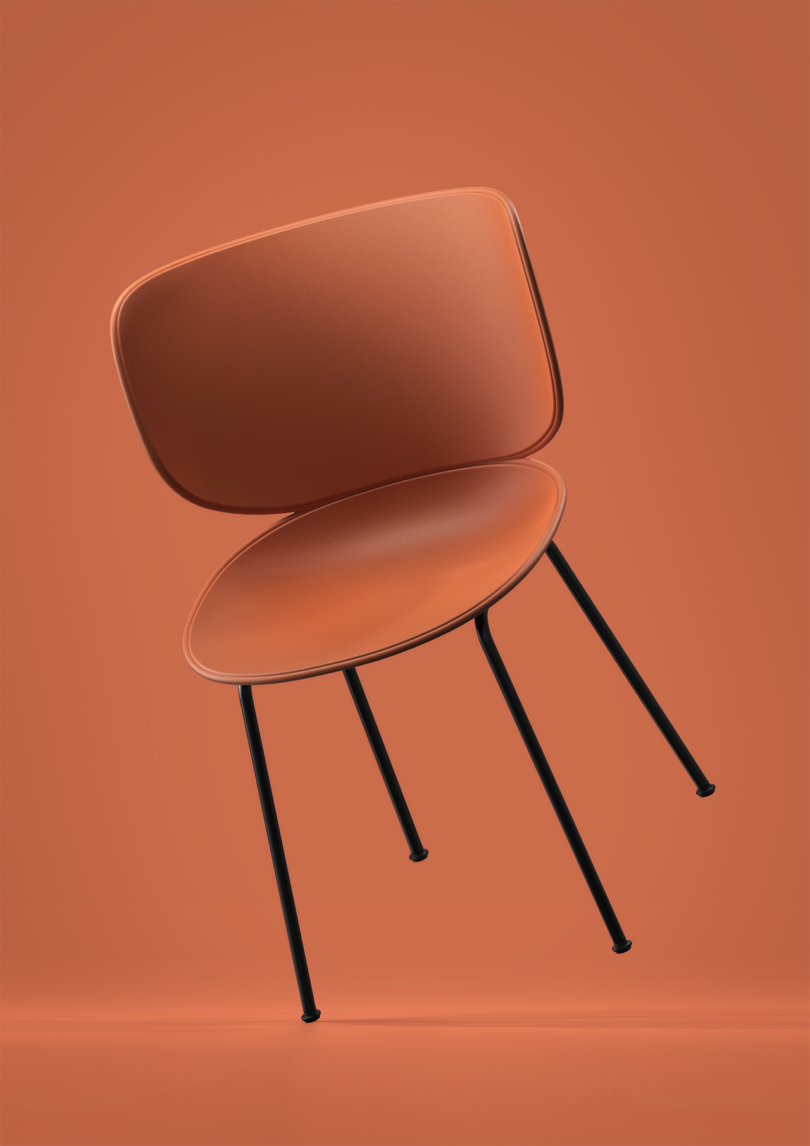 detail of a modern terracotta chair on a terracotta background