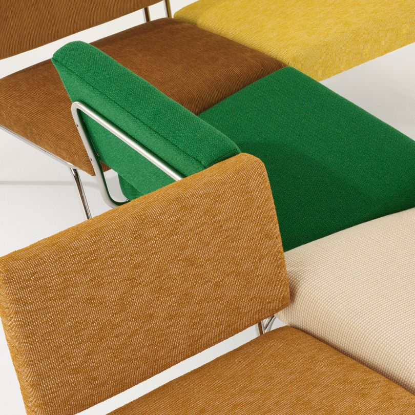 detail of brown, cream, green, and goldenrod lounge chairs