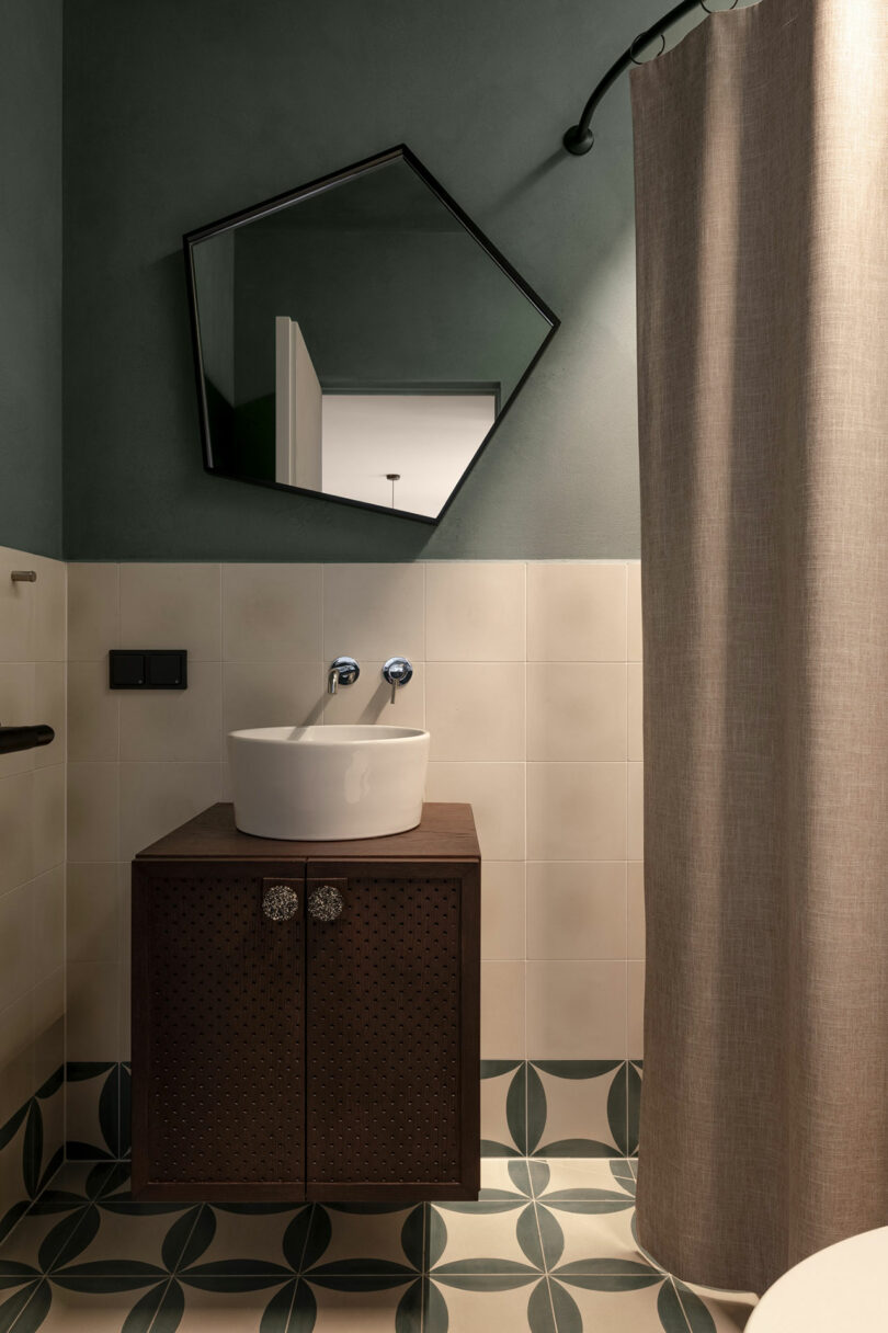 small modern bathroom with vessel sink and five sided mirror