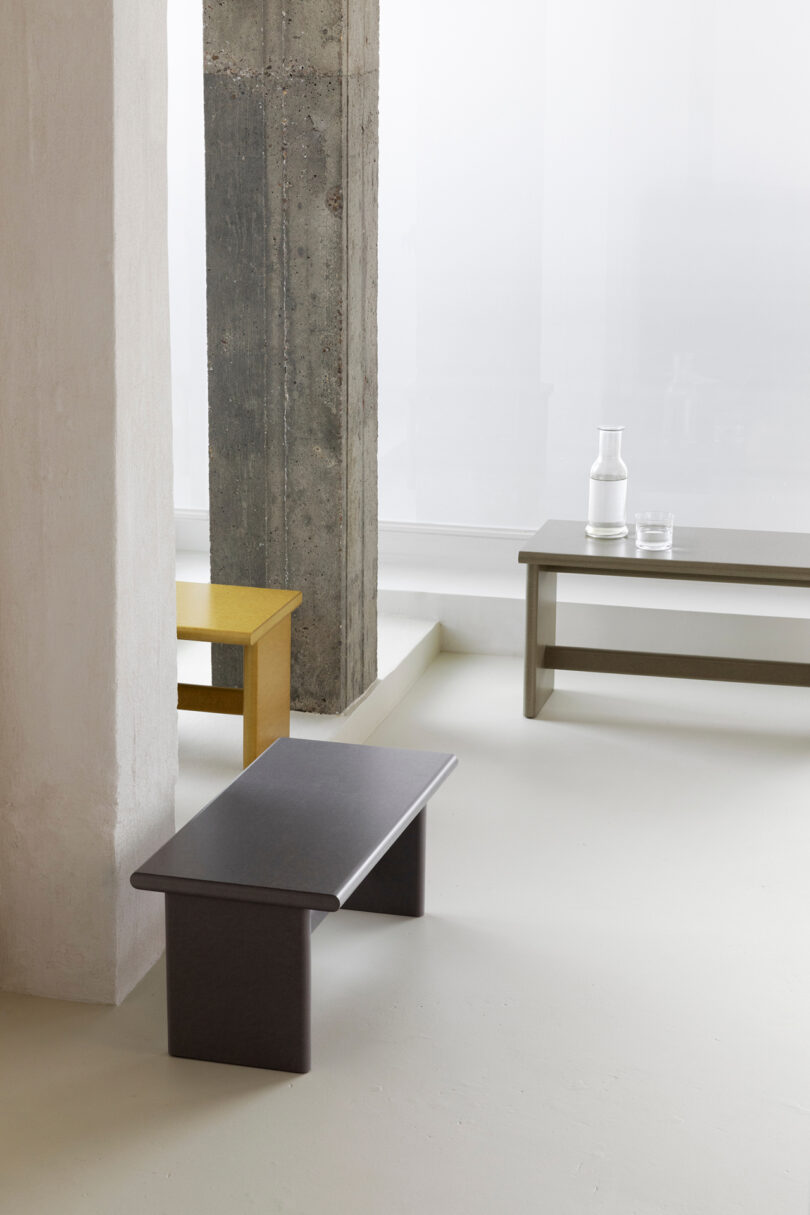 three rectangular-shaped tables in a studio setting