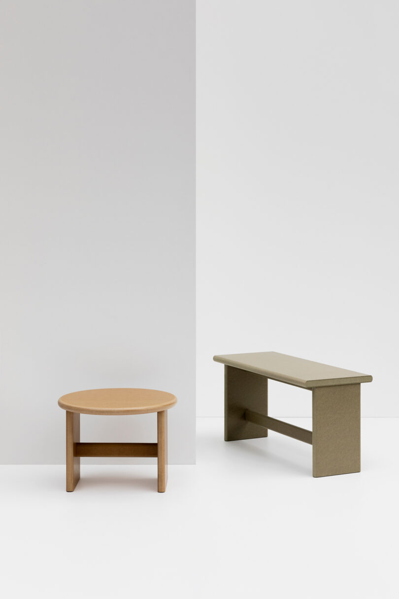 one rectangle-shaped table and one round table in a studio setting