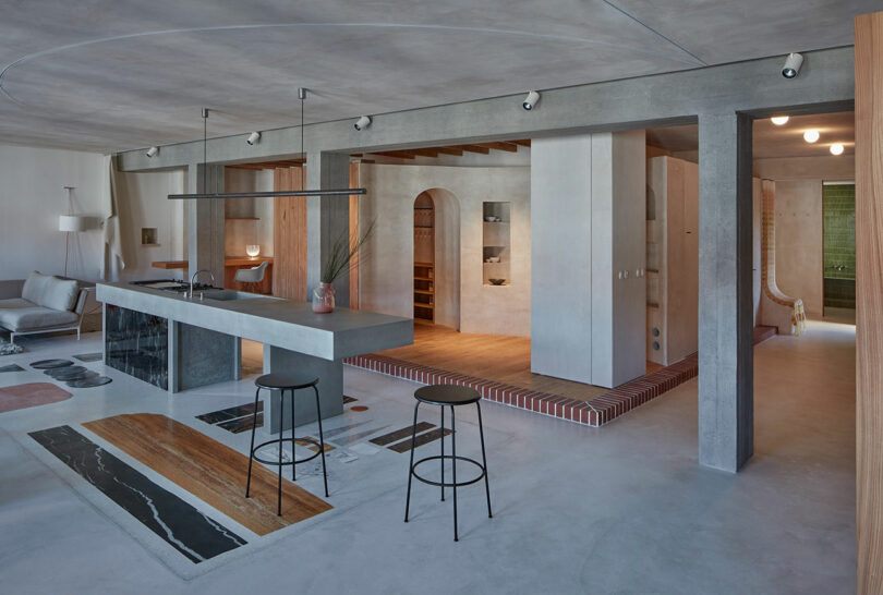 interior angled view of modern kitchen in gray apartment