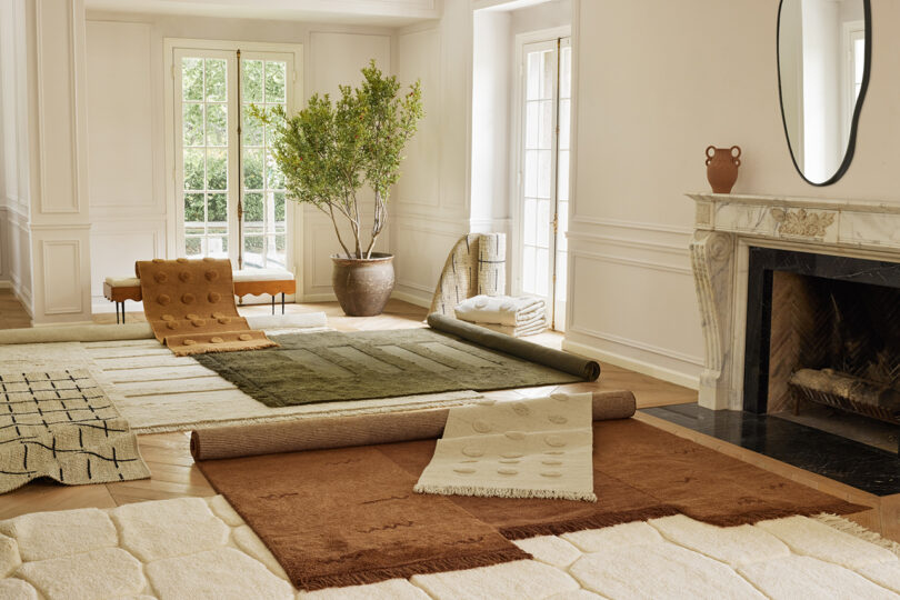 collection of rugs arranged in a styled interior space