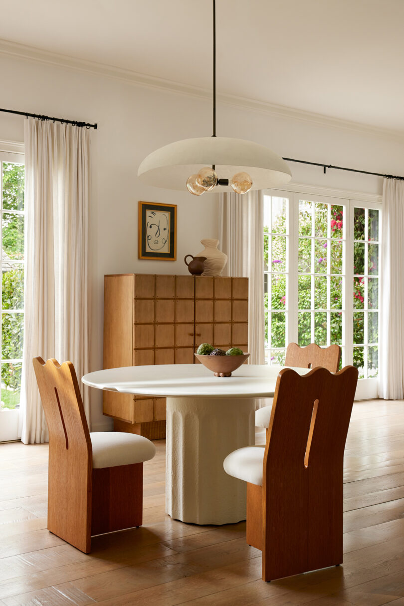 styled dining space with a neutral palette of modern furniture