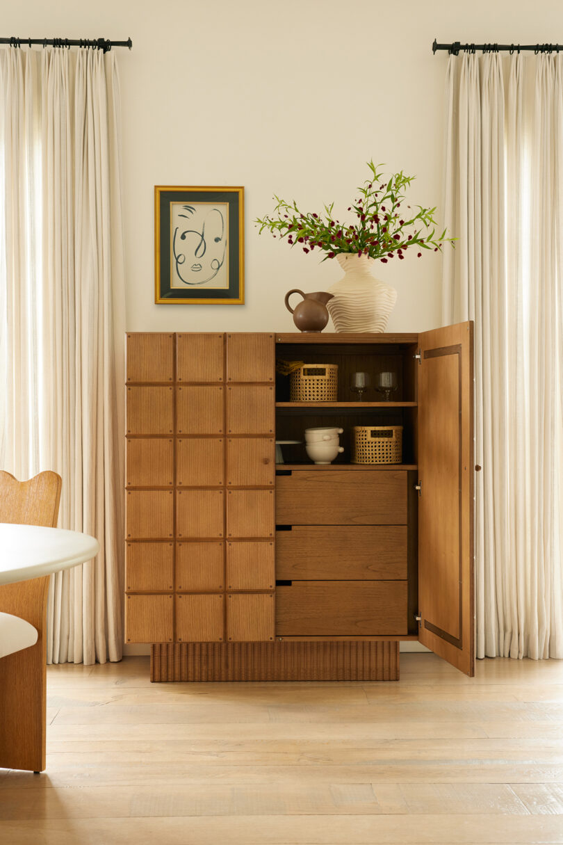 styled space with large wood storage cabinet