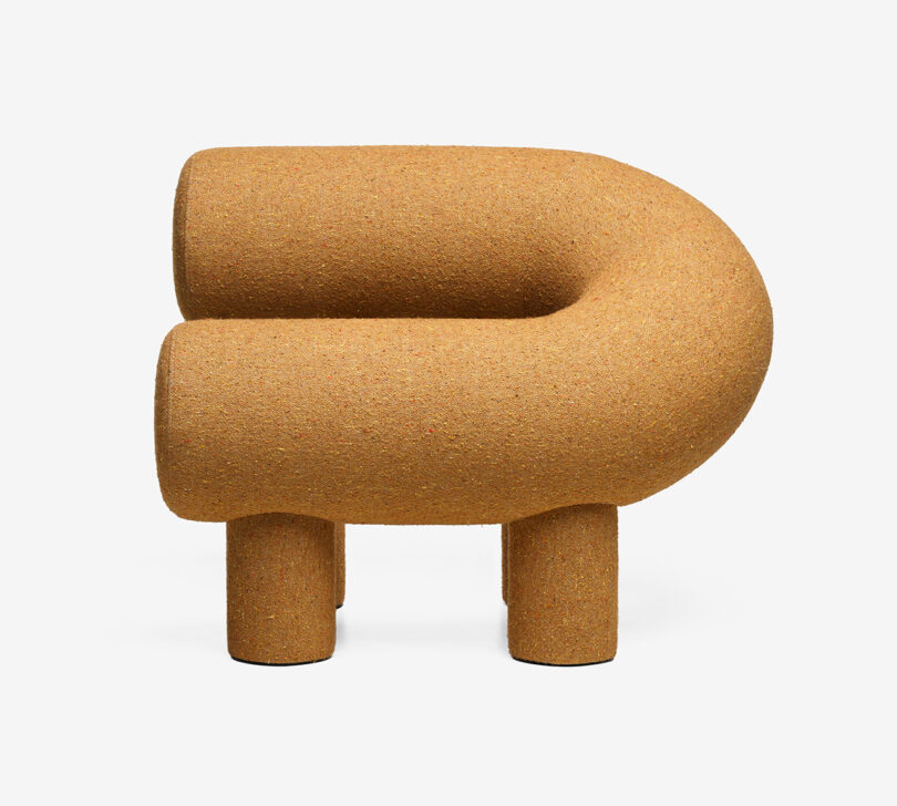goldenrod C-shaped armchair on white background