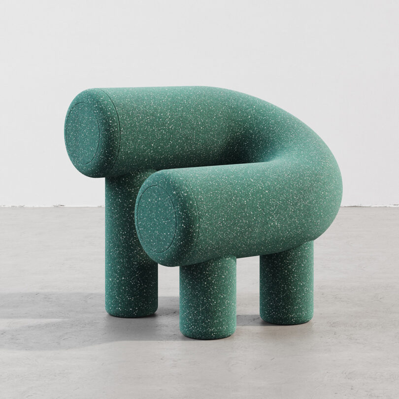 green C-shaped armchair