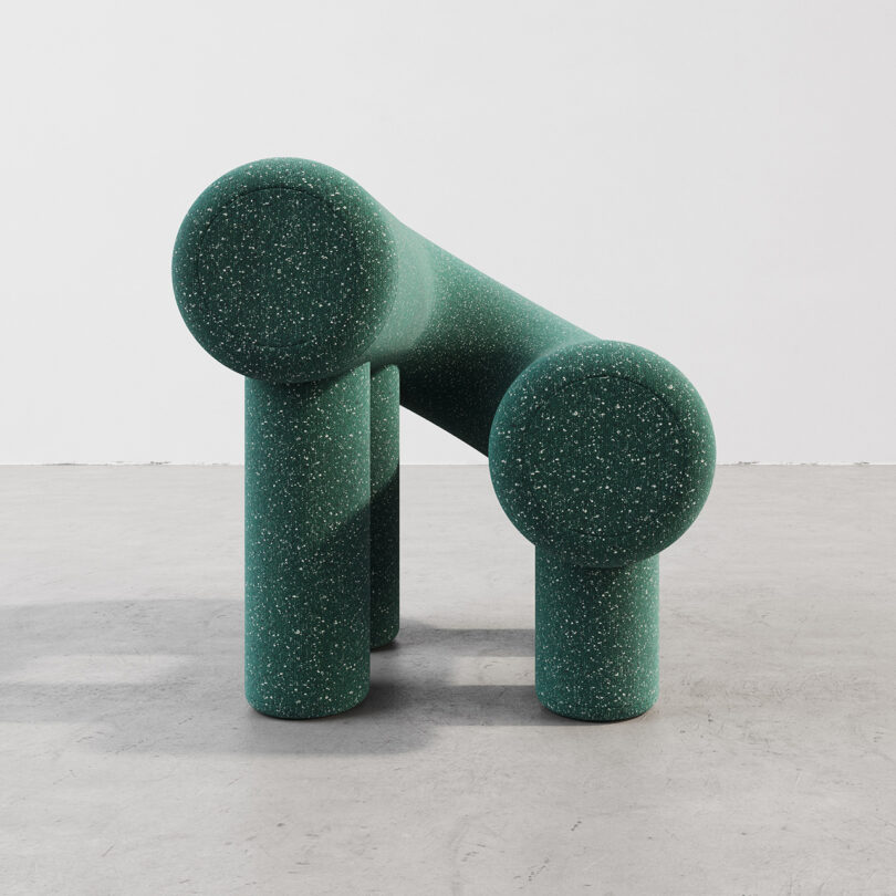 green C-shaped armchair
