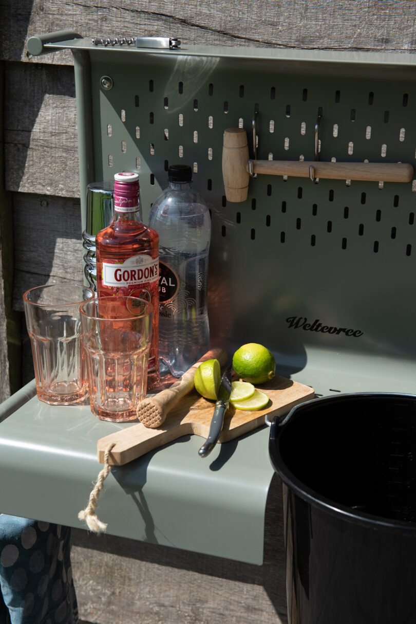 outdoor wall mounted sshelf sinkink set up as a cocktail bar