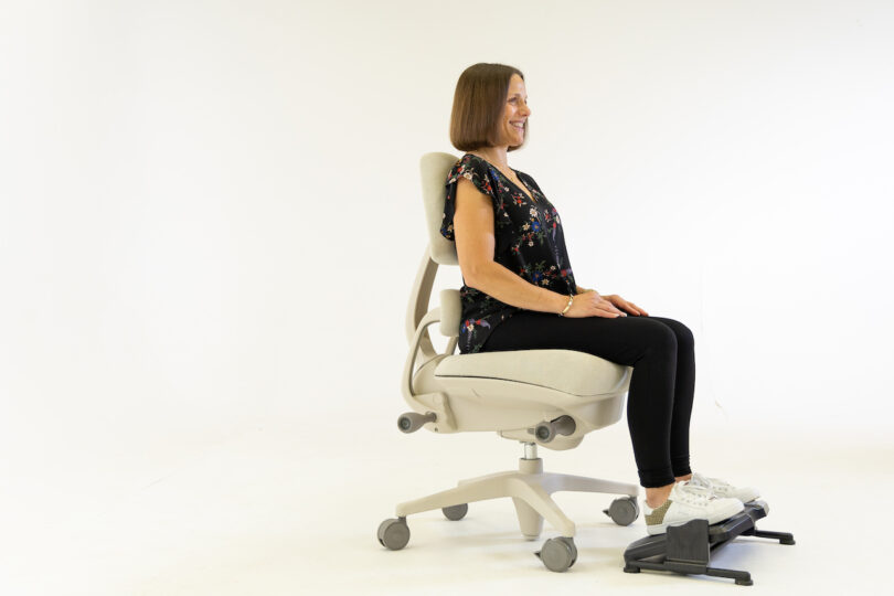 woman sitting on beige task chair