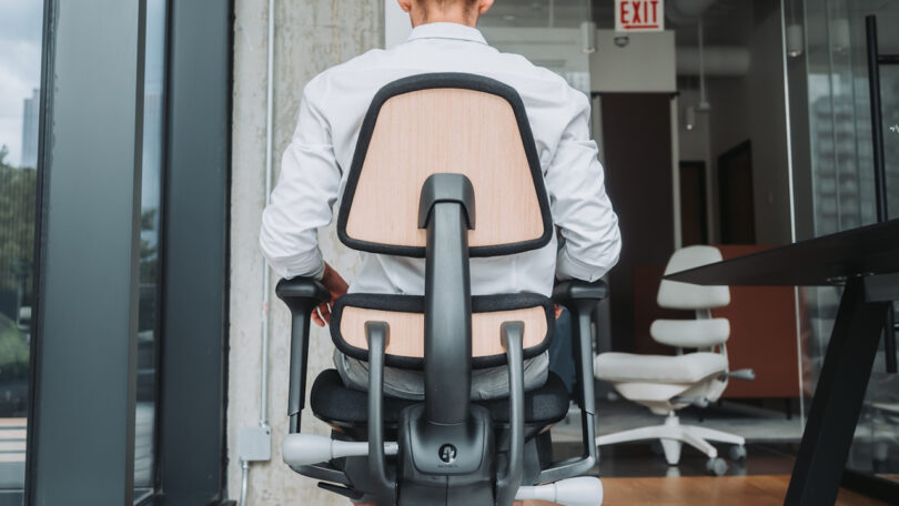 back view of man sitting on a task chair