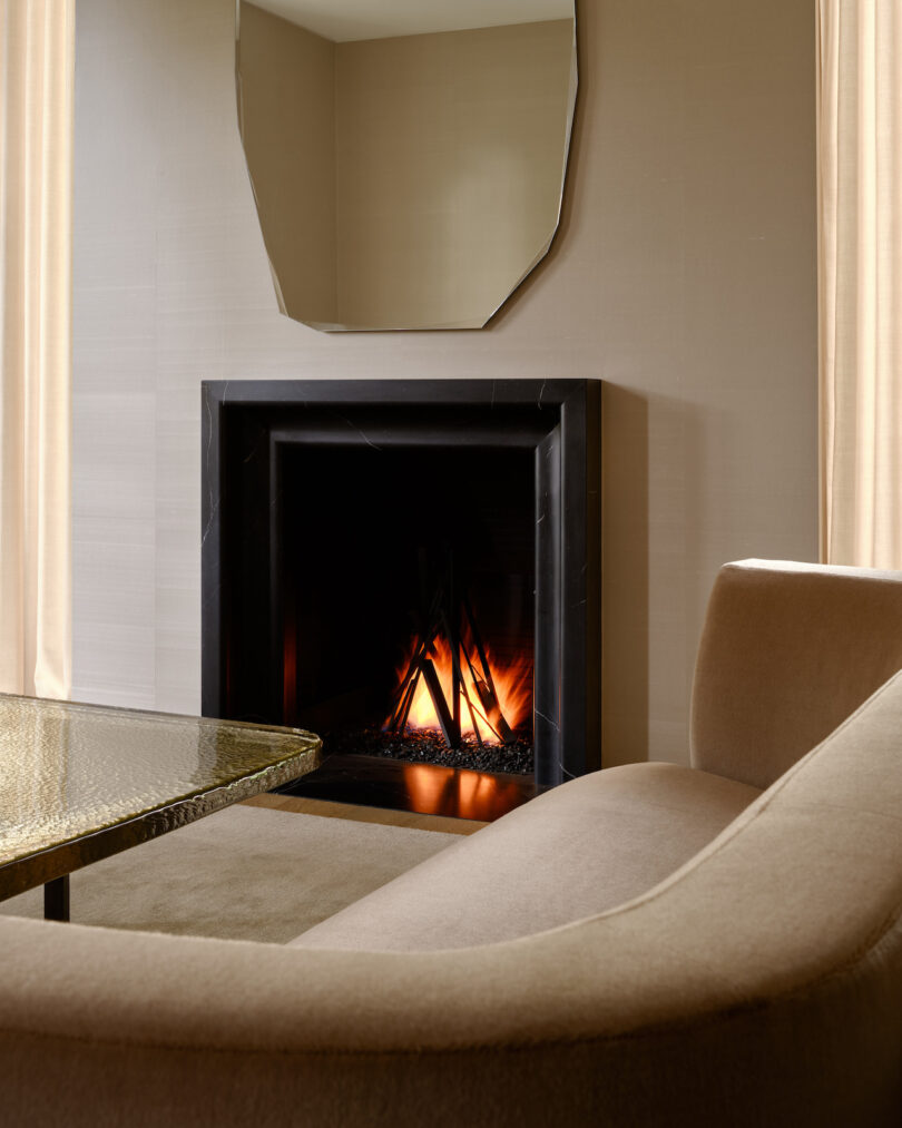 A living room area showcasing a custom coffee table crafted from a poured glass slab