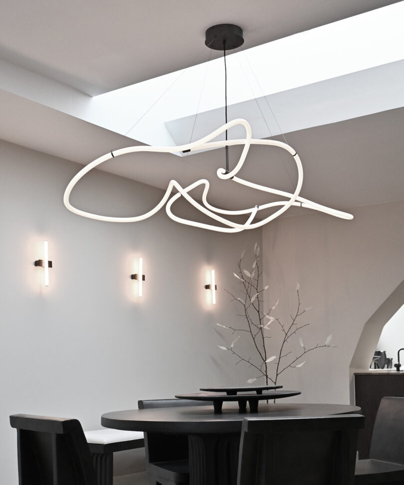 white pendant light above dining table