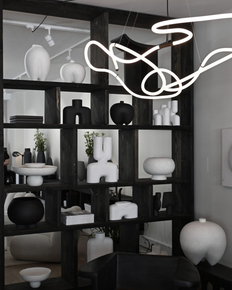 white pendant light in monochromatic dining room