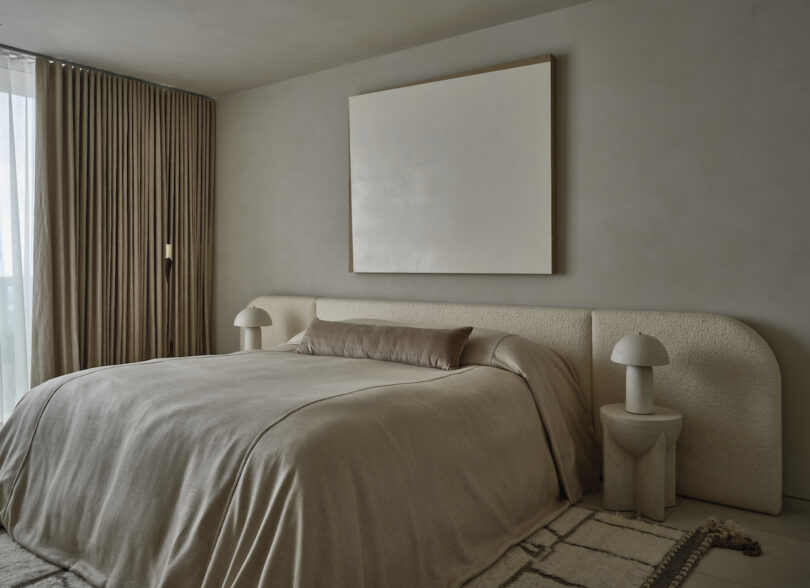 Zen primary bedroom offering a serene retreat, adorned with tranquil artworks by Manolo Ballesteros and Eline Baas.