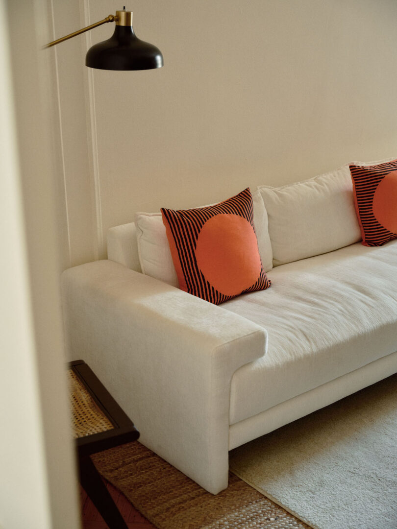 two red pillows on white sofa