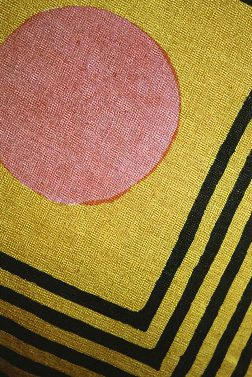 close up detail of block print design on pillow