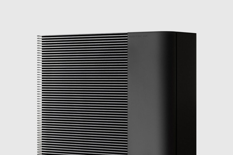 Close up of the Electric Air's residential electric heat pump system condenser grill in black.