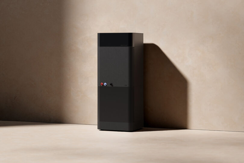 Electric Air's HEPA Filtration unit, a large vertically oriented black rectangle where air filtration and humidity control are handled, set along a sand colored wall and floors.