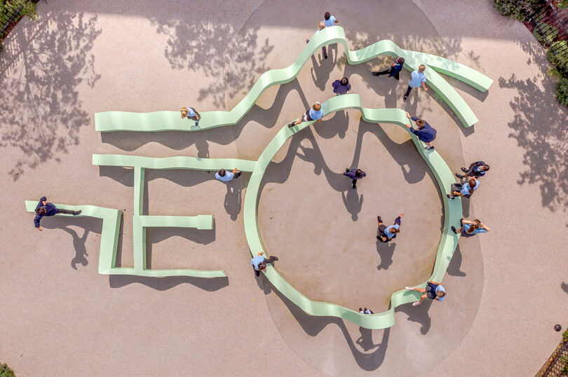 overhead image of a large seafoam green abstract undulating outdoor interactive art installation