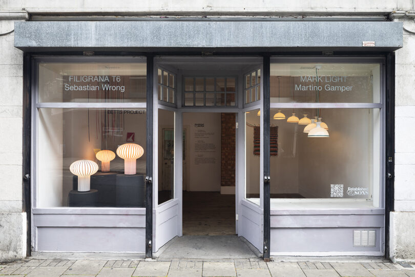 storefront windows filled with table lamps and pendant lights