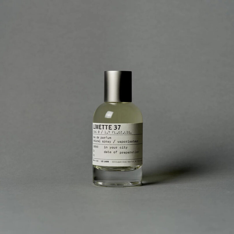 bottle of perfume reading LIMETTE 37 on a grey background